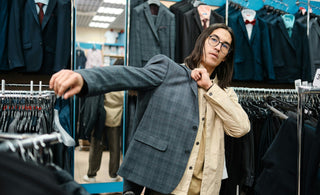 man trying on suit